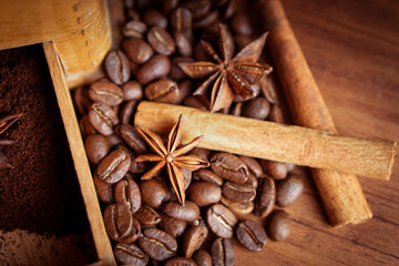 Vintage classic antique italy german hand manual ground coffee grinder powder of organic roasted espresso bean cinnamon star anise aroma in retro old wooden rustic homemade cafe shop barista style