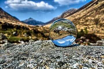 globe in the mountains lens ball Scotland landscapes