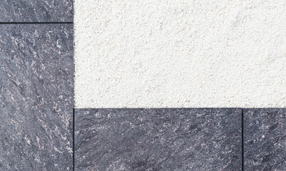 Fototapeta premium Fragment of a granite tombstone on the grave