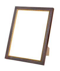 Empty dark brown wooden photo frame with golden border on stand isolated on white background