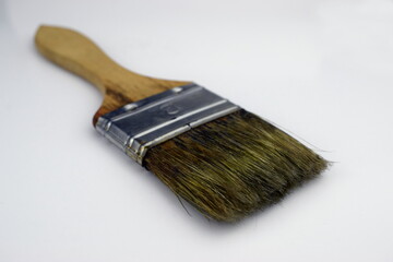 Flat paintbrush in perspective on a white background