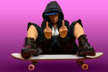 Funny portrait of mature woman. Lady having fun with skate dressed as rapper