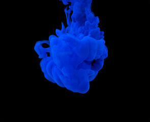 explosion of acrylic blue paint in clear water. Black background