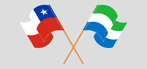 Crossed and waving flags of Chile and Sierra Leone