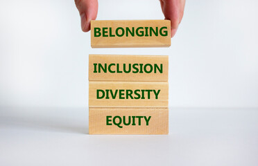 Equity, diversity, inclusion and belonging symbol. Wooden blocks with words 'equity, diversity,...