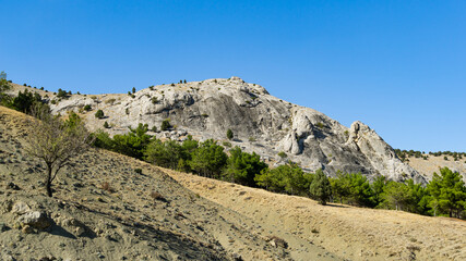 Fototapeta na wymiar Mountains near Veseloe village near Sudak. Crimea mountain landscape on sunny autumn day.