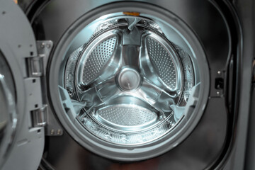 Washing machine laundry home appliance closeup of inside drum.
