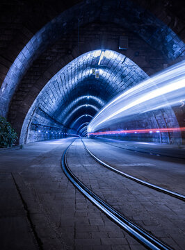 Illuminated Tramway Tunnel with Tram Light Trails at Night in Bratislava, Slovakia