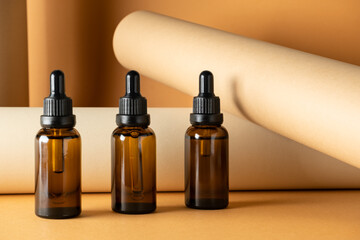 Brown glass bottles with pipettes mockup. Natural spa beauty products. Mineral organic oil. Eco...