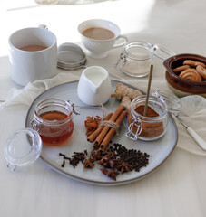 cup of tea with cookies and cinnamon