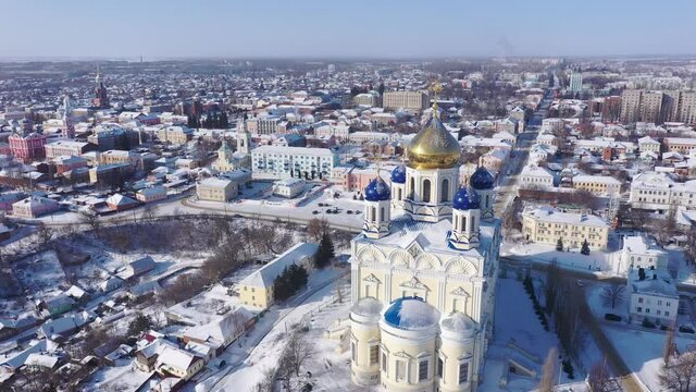 Aerial view of the Ascension Cathedral, located in the historical center of the city on the Red Square of Yelets, and the surrounding his residential areas in winter, Russia.