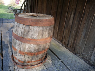 Fototapeta premium old wooden barrel on farmhouse porch