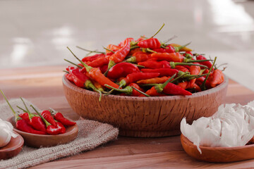 cayenne pepper and garlic on a coconut wood plate