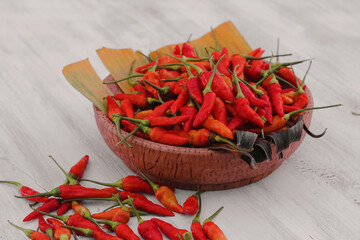 cayenne pepper on a coconut wood plate