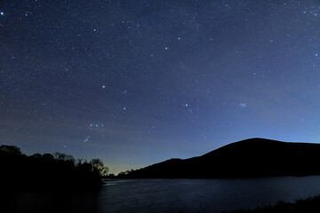 Fototapeta na wymiar Ireland - Lough Gur at Night time with Stars, Mars and Sirius