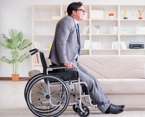 Dsabled businessman on wheelchair working home