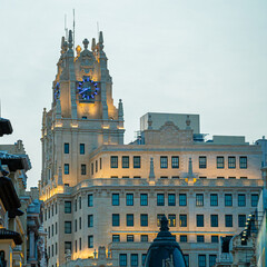 Photographs of the Telefónica building on Gran Vía street in Madrid in Spain during sunset