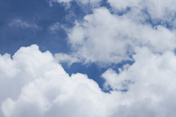 Naklejka na ściany i meble Big white clouds under a huge blue sky