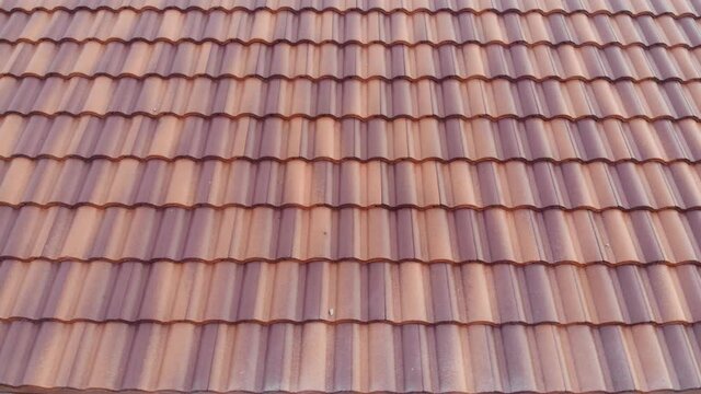 Modern brown roof of new house in suburban architech construction site aerial view