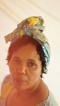 Portrait of elderly woman in headwrap
