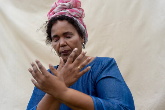 Portrait of elderly woman praying