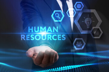 Business, Technology, Internet and network concept. Young businessman working on a virtual screen of the future and sees the inscription: Human resources