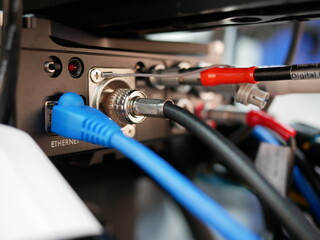 BNC cable connector into video camera in the studio at TV station,selected focus.