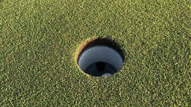 Golf ball into a Hole