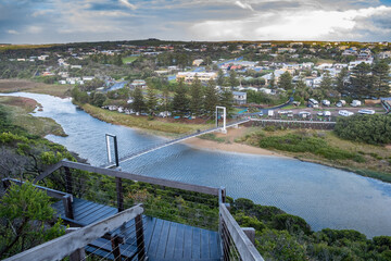 Scenic view of the Port Campbell Creek Pedestrian Bridge and the township in Victoria, Australia