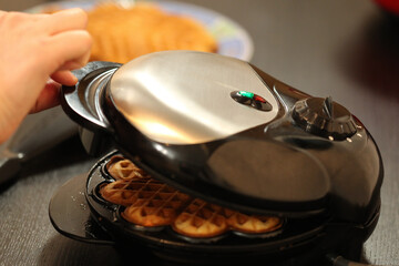 bake waffles, cooking, in the kitchen is living, it smells good, ready