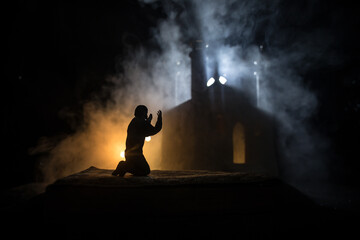 Silhouette of mosque building on toned foggy background. Ramadan Kareem background. Mosque at...