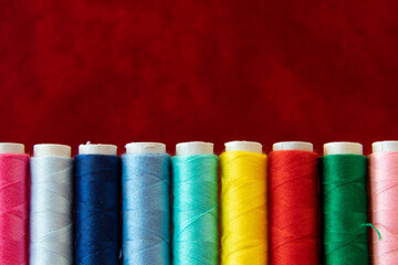 multicolor Sewing threads red background