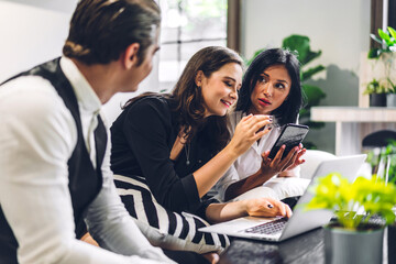 Group of professional business discussing meeting strategy sharing idea with new project.Creative business people working with laptop computer in green plant terrace decorated modern workloft
