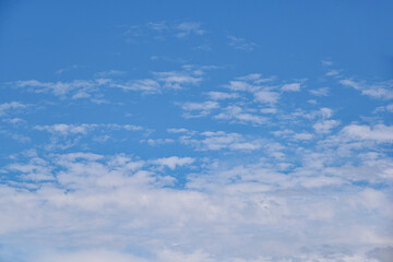 Beautiful white clouds on blue sky background.