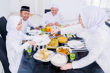 Happy Muslim woman preparing foods for family