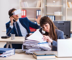 Employee with virtual reality glasses in office
