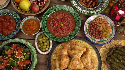 Ramadan dinner table top view. Arabic Cuisine: Middle Eastern traditional lunch. Iftar meal eaten by Muslims after sunset. Assorted of Arabic oriental dishes