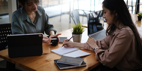 Serious corporate business team discuss and planning paperwork at group briefing. fund manager team brainstorming investment in stock market