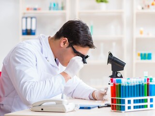 Young chemical scientist working in lab