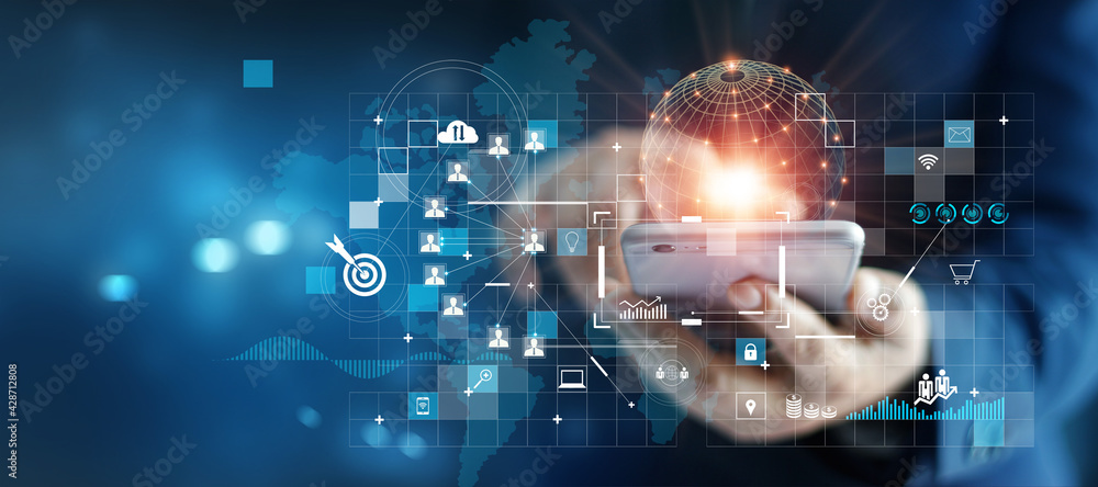 Leinwandbilder Businessman using mobile smartphone on global network connection on investor and customer with sale data exchange and development of business. Technology and digital marketing. Financial and banking..