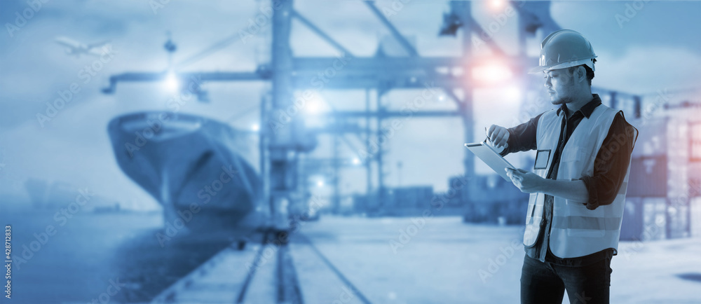 Aufkleber Business logistic and import export. Engineer. Foreman check timing and using tablet control loading container from cargo freight ship to truck for logistic network distribution. transportation.