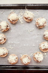 Cooking julienne in baskets in the oven. The concept of homemade food or semi-finished products, heated restaurant food during the virus epidemic