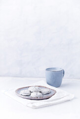 White chocolate cookies and Cappuccino on bright wooden background. Copy space.