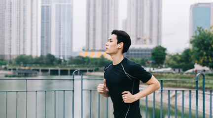 Asian man is jogging in the park