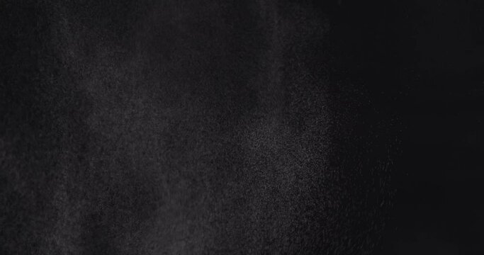 Water spray from bottle isolated on black backdrop. Water spray mist. Aerosol jet spraying. Steam or gas jet with particles.