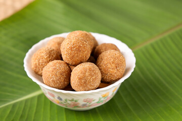 Rice balls, popular traditional sweet and savory tea time snack of Kerala India made of flour on Onam, Vishu, Ramadan festivals. crunchy South Indian food.