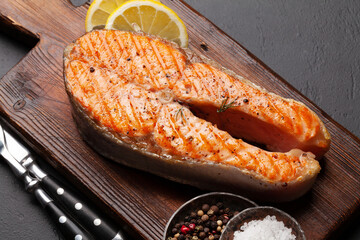 Grilled salmon steak. Fish steak with herbs and spices
