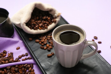 Composition with cup of tasty coffee and beans on color background, closeup