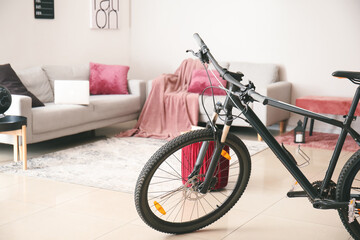 Modern bicycle in interior of living room