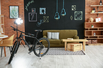 Interior of stylish living room with bicycle